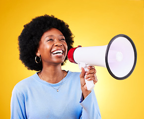 Image showing Happy black woman, megaphone and voice in promotion, advertising or marketing on a yellow studio background. African female person, smile or bullhorn for loudspeaker in sale announcement or alert