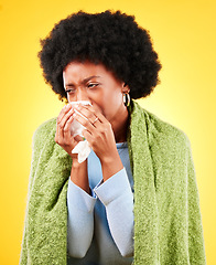 Image showing Blanket, sneeze and sick woman in studio for cold, allergies or allergy of medical virus on yellow background. African model, tissue and fever of healthcare, sinusitis or bacteria of winter wellness