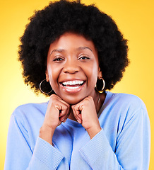 Image showing Portrait, smile and black woman hands on chin in studio, face and excited for skincare and cosmetics on yellow background. Happy, wellness and person with glow for aesthetic and natural beauty