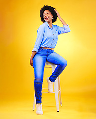 Image showing Black woman, thinking and smile on a chair in studio, yellow background or natural happiness with casual fashion and style. African, gen z or model relax with ideas for creative, mockup or space
