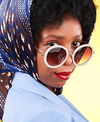 Image showing Fashion, makeup and sunglasses with portrait of black woman in studio for vintage, trendy and beauty. Elegant, retro and pride with face of person and scarf on yellow background for frames and style
