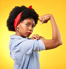 Image showing Power, flex and success with portrait of black woman in studio for muscle, motivation and energy. Empowerment, pride and champion with person and fist on yellow background for challenge and hard work
