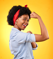 Image showing Muscle, flex and smile with portrait of black woman in studio for power, motivation and energy. Empowerment, pride and champion with person and fist on yellow background for challenge and hard work