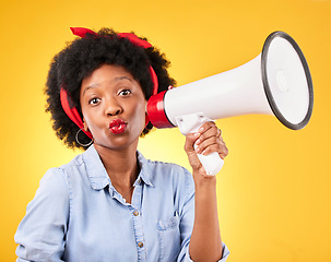 Image showing Woman, megaphone and portrait for announcement, broadcast or fashion news on yellow background. Young gen z or african person with kiss face emoji and sale, voice or discount communication in studio