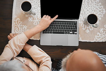 Image showing Laptop, couple and hands of woman point at screen on living room table for comic show, internet video or film. Technology, people and watching tv on computer for relax and streaming with coffee