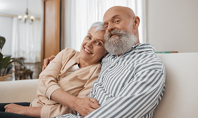 Image showing Smile, portrait and senior couple on a sofa in the living room of modern home for bonding. Happy, love and elderly man and woman in retirement hugging and relaxing together in the lounge of a house.