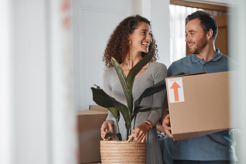 Image showing Moving, new home or happy couple with boxes in real estate, property or rental apartment. Woman, proud man or excited people walking together carrying or lifting package in a house on loan with smile