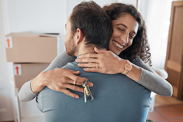 Image showing House keys, success or happy couple hug in real estate, property investment or buying apartment. New home goal, achievement or excited man with smile or woman to celebrate moving in flat together