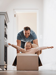 Image showing Kid, father and pushing box in new house playing games or race with speed for bond, love or happiness. Dad, playful or excited child in cardboard with support, smile or trust on floor in family home