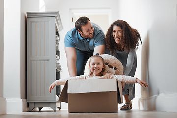 Image showing Child playing, father or mother pushing box in new house in a race or game for bond, love or happiness. Dad, playful mom or excited girl kid in cardboard with support, smile or parents in family home