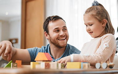 Image showing Building blocks, toys and girl with happy dad playing in living room for education, development and learning in creative games. Montessori, child and father bonding with kid in family home lounge