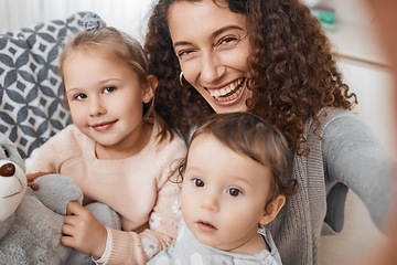 Image showing Selfie, smile and portrait of mother with her children bonding, relaxing and playing in the living room. Happy, love and young mom taking a picture with her kids for memory together in lounge at home