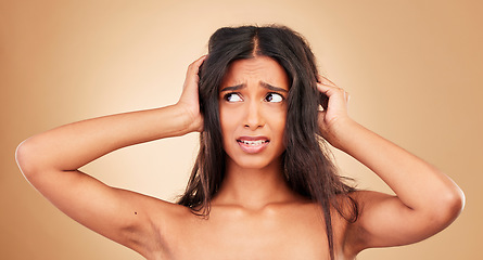 Image showing Hair loss, stress and woman with crisis, disaster and hairdresser fail in studio on brown background. Natural, frustration and shocked person, messy and tangled treatment for haircare and girl