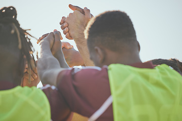 Image showing Football, teamwork and men holding hands, fitness and cooperation with collaboration, training and exercise. People, group and players with support, soccer and workout with practice and motivation