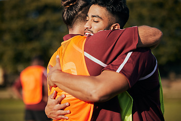 Image showing Hug, soccer and men with fitness, support and celebration with teamwork, cooperation and training. People, healthy players or friends on a field, sports or embrace with exercise, winning or gratitude