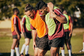 Image showing Help, soccer and a man with an injury on the field after a fitness or sports accident. Medical, training and friends or team with support for an athlete with a football emergency, pain or hurt muscle