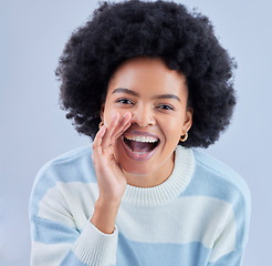 Image showing Portrait, announcement and black woman shouting secret in studio isolated on a blue background. Face, smile and person sharing gossip, news or speaking of information for communication of promotion