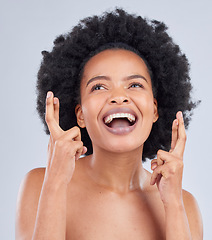 Image showing Hope, luck and black woman with fingers crossed for beauty and skincare isolated in a studio gray background with smile. Notification, deal and young person excited for cosmetics with optimism