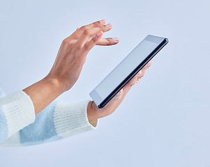 Image showing Hands, tablet and person on studio for social media, reading ebook and search website on gray background. Closeup, model and digital technology for connection, download and scroll online shopping app