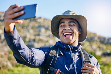 Image showing Selfie, freedom and a man hiking in the mountains for travel, adventure or exploration in summer. Nature, smile and photography with a happy young hiker taking a profile picture outdoor in the sun