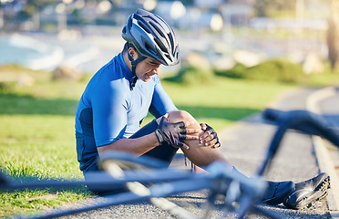 Image showing Man, outdoor and biker with knee pain, road and emergency with accident, health issue and fitness. Person, cyclist and athlete with broken leg, inflammation and bruise with medical problem and injury