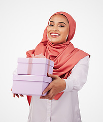 Image showing Woman, winner portrait and gift box, offer or prize for giveaway and shopping on a white background. Muslim person in Saudi Arabia with present, ribbon package and winning or competition in studio