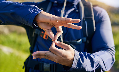 Image showing Closeup, hiking and a hand of a person in nature for fitness, training or a sign for exercise. Morning, mountain and an athlete with a gesture for travel, sports or cardio walking or trekking