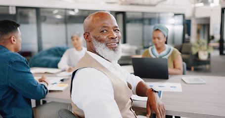 Image showing Smile, meeting and portrait of black man in office with corporate business people. Strategy, planning and collaboration, mature businessman in conference room for professional workshop in Africa.