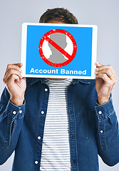 Image showing Banned, account and man with a sign for social media, guidelines and rules for online profile and poster in studio background. Internet, ban and person with a banner in hands for virtual exclusion