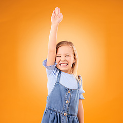 Image showing Learning, hands raised and happy kid with question in studio isolated on an orange background mockup space. Excited, answer and girl student asking why, knowledge and education at kindergarten school