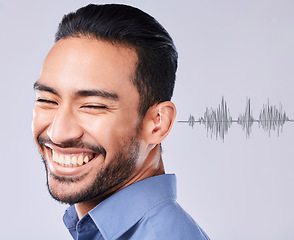 Image showing Man, smile and deaf with sound wave overlay on a gray background in studio for communication or listening. Face, happy and audio with the ear of a young person hearing noise translation or connection