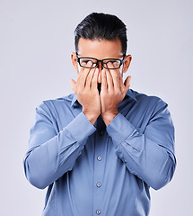 Image showing Stress, headache and man with glasses in studio for vertigo, eye strain or blurry vision on white background. Anxiety, optometry and male with migraine, brain fog or burnout with mental health crisis