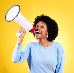 Image showing Happy black woman, megaphone and speaker in advertising or marketing against a yellow studio background. African female person, smile or voice with loudspeaker in announcement, alert or discount sale