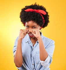 Image showing Fashion, fight and boxing with portrait of black woman in studio for power, motivation and energy. Empowerment, pride and champion with person and fist on yellow background for challenge and strong