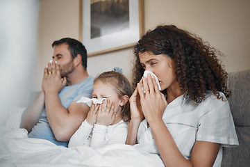 Image showing Parents, girl and bed with tissue, blowing nose and sick together with allergies, flu or covid in house. Father, mother and daughter with toilet paper, cleaning and hygiene for sneeze in family home