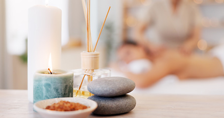 Image showing Spa, rock and candle to relax in a room with atmosphere, mood or ambience in a health club. Wellness, luxury and treatment with still life objects on a table in a clinic for rest and relaxation