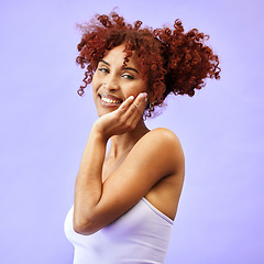 Image showing Hand on face, natural beauty and woman, hair care and wellness with smile isolated on purple background. Dermatology, haircare and cosmetics, portrait with red curls and skin glow in a studio