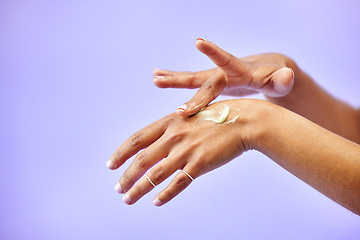 Image showing Hands, dry skin and woman with cream for studio skincare, cosmetics or wellness on purple background. Bodycare, beauty or lady model with lotion, dermatology or eczema, acne or treatment application