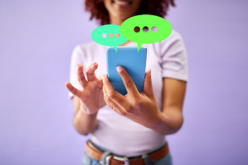 Image showing Phone, hands and woman on social media speech bubble in studio isolated on purple background mockup space. Smartphone, communication and person on chat, feedback opinion or voice notification online