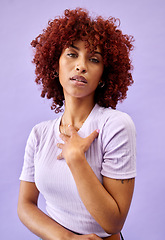 Image showing Serious, portrait and African woman with fashion, natural beauty and gen z confidence on purple background in studio. Dermatology, face and model with pride, style and pose for cosmetics or skincare