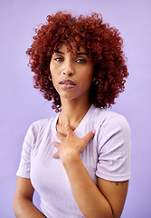 Image showing Serious, portrait and African woman with fashion, natural beauty and gen z confidence on purple background in studio. Dermatology, face and model with pride, style and pose for cosmetics or skincare