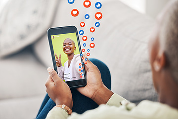 Image showing Phone screen, hands and person with social media emojis, icons and watch video, app post or influencer. Home smartphone, peace sign and user streaming vlog, content creator and relax on lounge couch