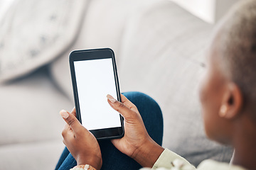 Image showing Hands of woman on sofa with phone screen, scroll and social media, message or video online. Technology, internet and girl on couch with smartphone, digital app and mockup for website or platform.