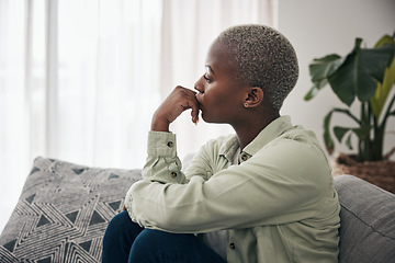 Image showing Woman, thinking and depression on sofa for sad memory, mental health risk and anxiety of debt. Stress, worry and lonely african person remember trauma of abuse, broken heart or doubt decision at home