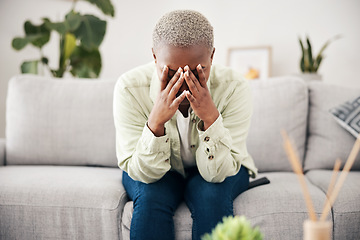 Image showing Woman, depression and crying on sofa for anxiety, mental health and stress of bad mistake at home. Doubt, sad and frustrated african person scared of trauma, headache and counselling of broken heart