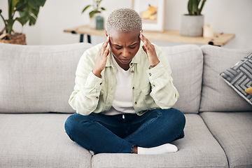 Image showing Stress, headache and pain with a black woman on a sofa in the living room of her home for mental health. Anxiety, burnout or vertigo and a young person in an apartment with depression or a migraine