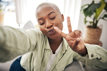 Image showing Woman, face and peace for selfie in home while live streaming vlog, post update or broadcast. Happy african content creator, profile picture or show v sign with hand emoji for social media influencer