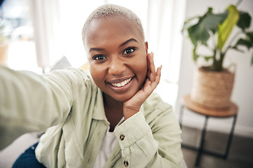 Image showing Home, portrait or black woman taking a selfie with a happy smile on sofa to post on social media. Apartment, face or African person taking a photo, vlog or picture on couch in living room to relax