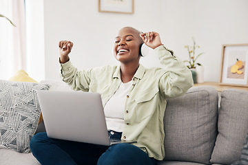 Image showing Music, headphones and black woman with laptop on sofa dance, happy and free in her home. Radio, earphones and African female dancing to online feel good podcast in living room smile for subscription