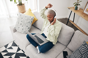 Image showing Laptop, home or woman in headphones dancing to music or streaming to relax with freedom. Top view, smile or happy African person listening to a radio song or audio on sofa on an online subscription